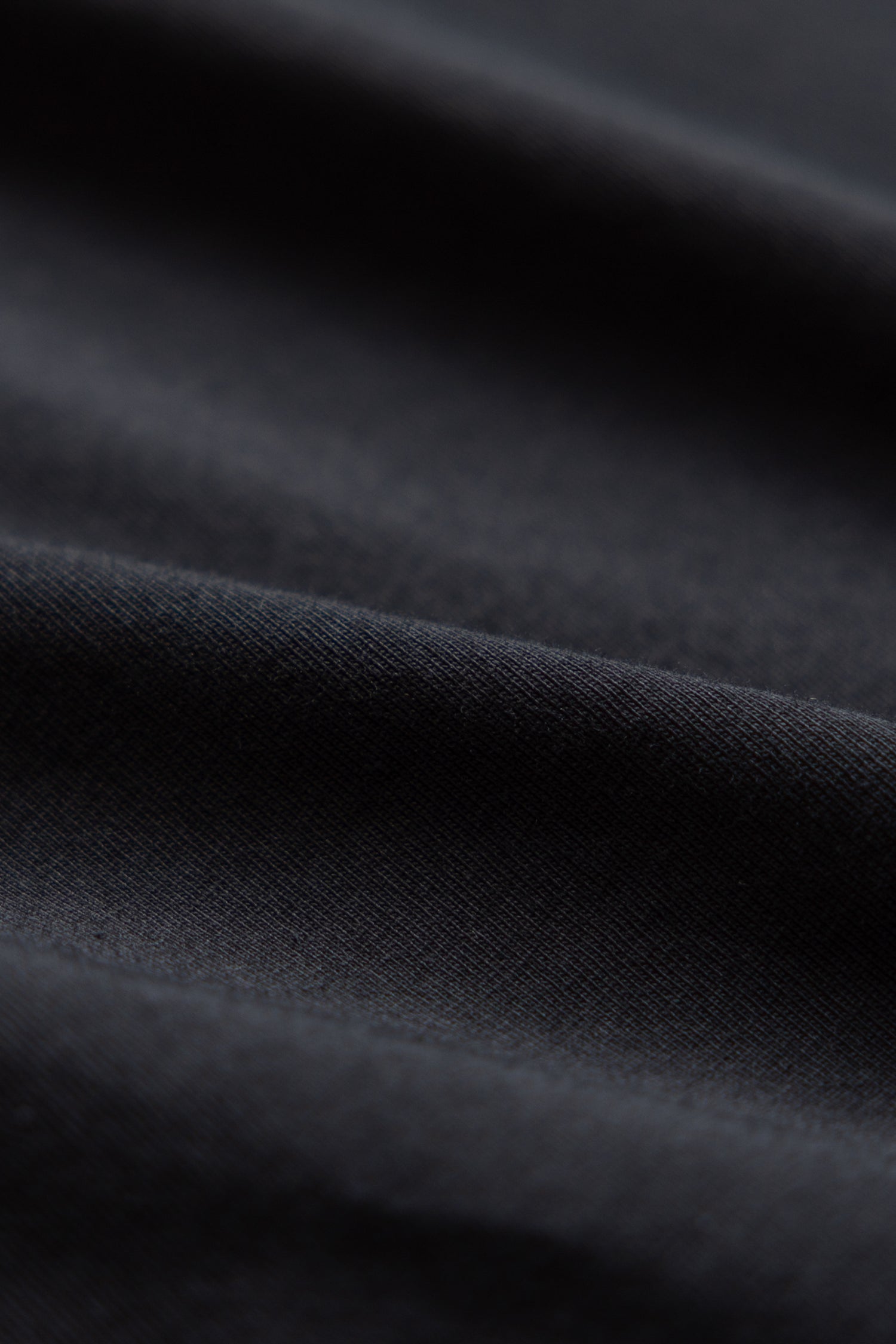 Close-up of black organic cotton t-shirt
