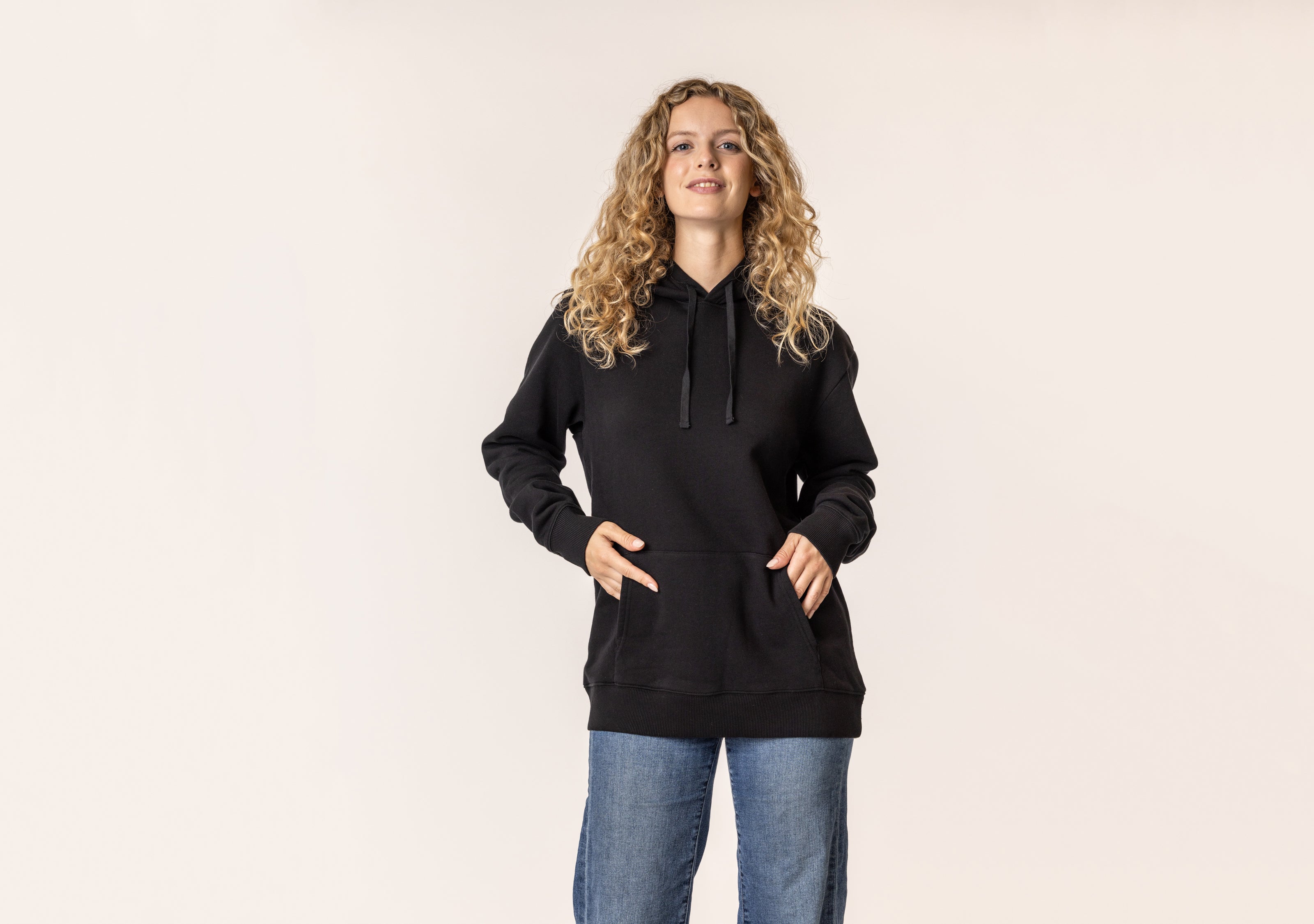 Woman wearing a black organic cotton hoodie