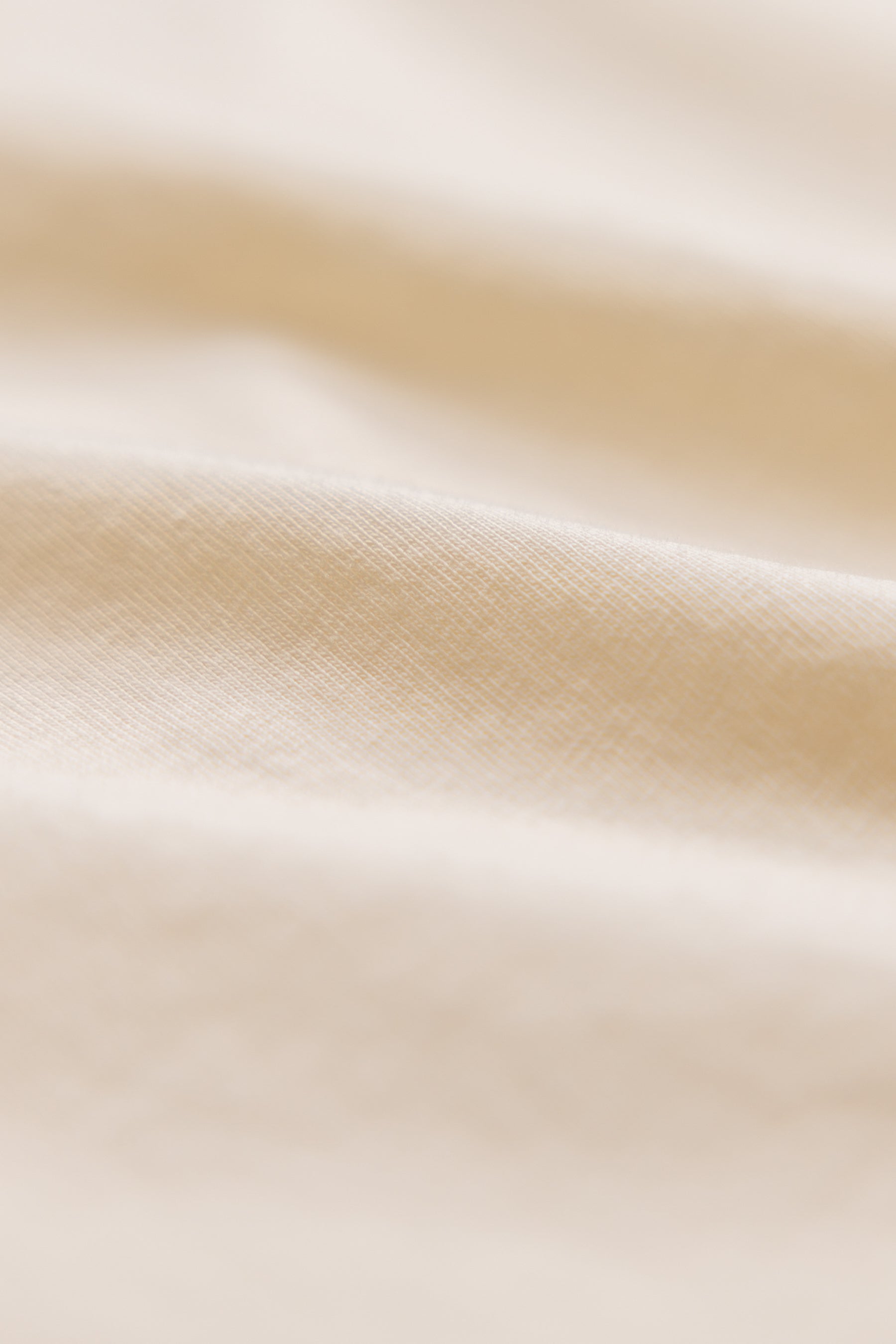 close up shot of natural color organic cotton t-shirt