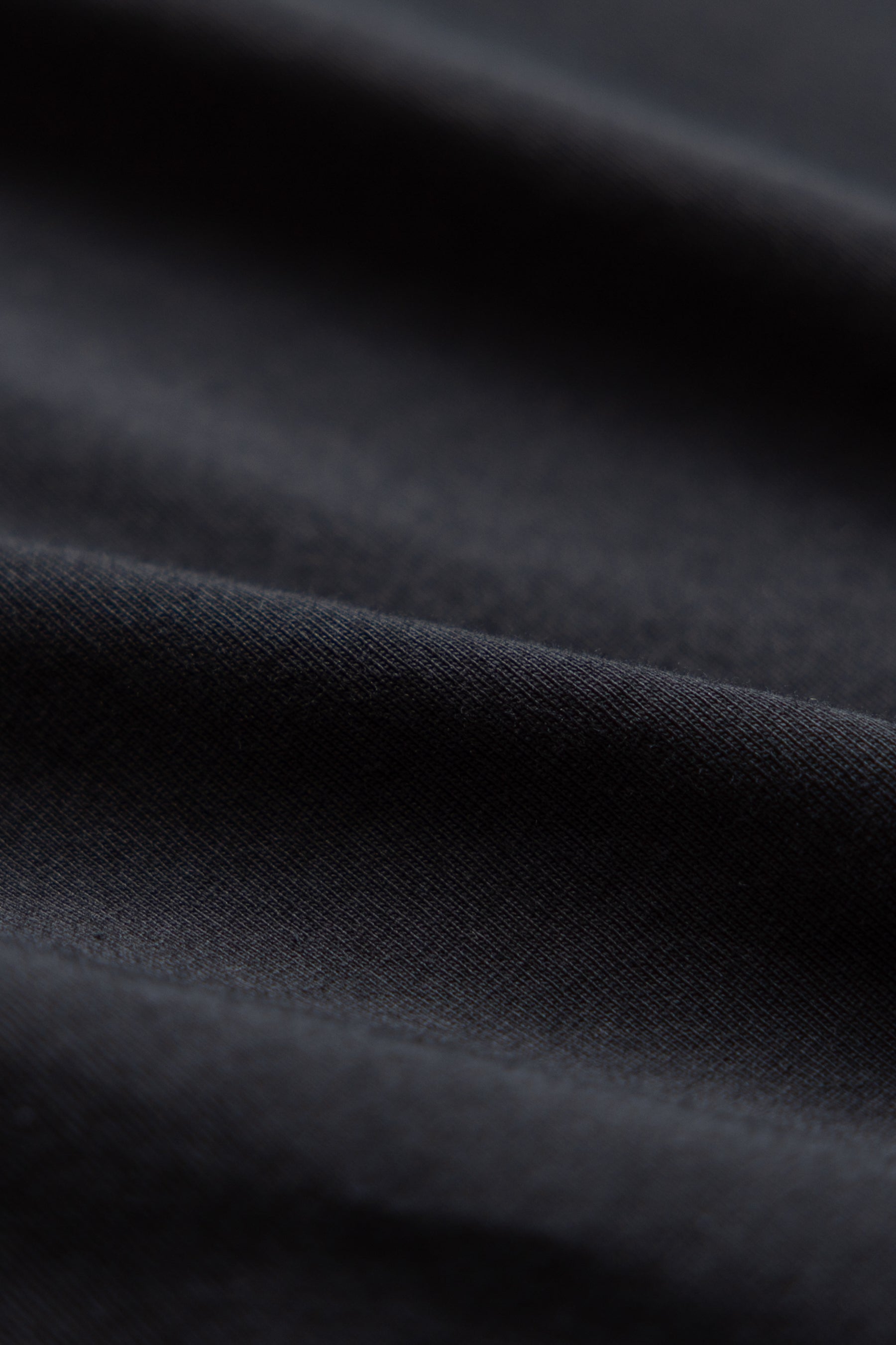 Close-up of black organic cotton t-shirt