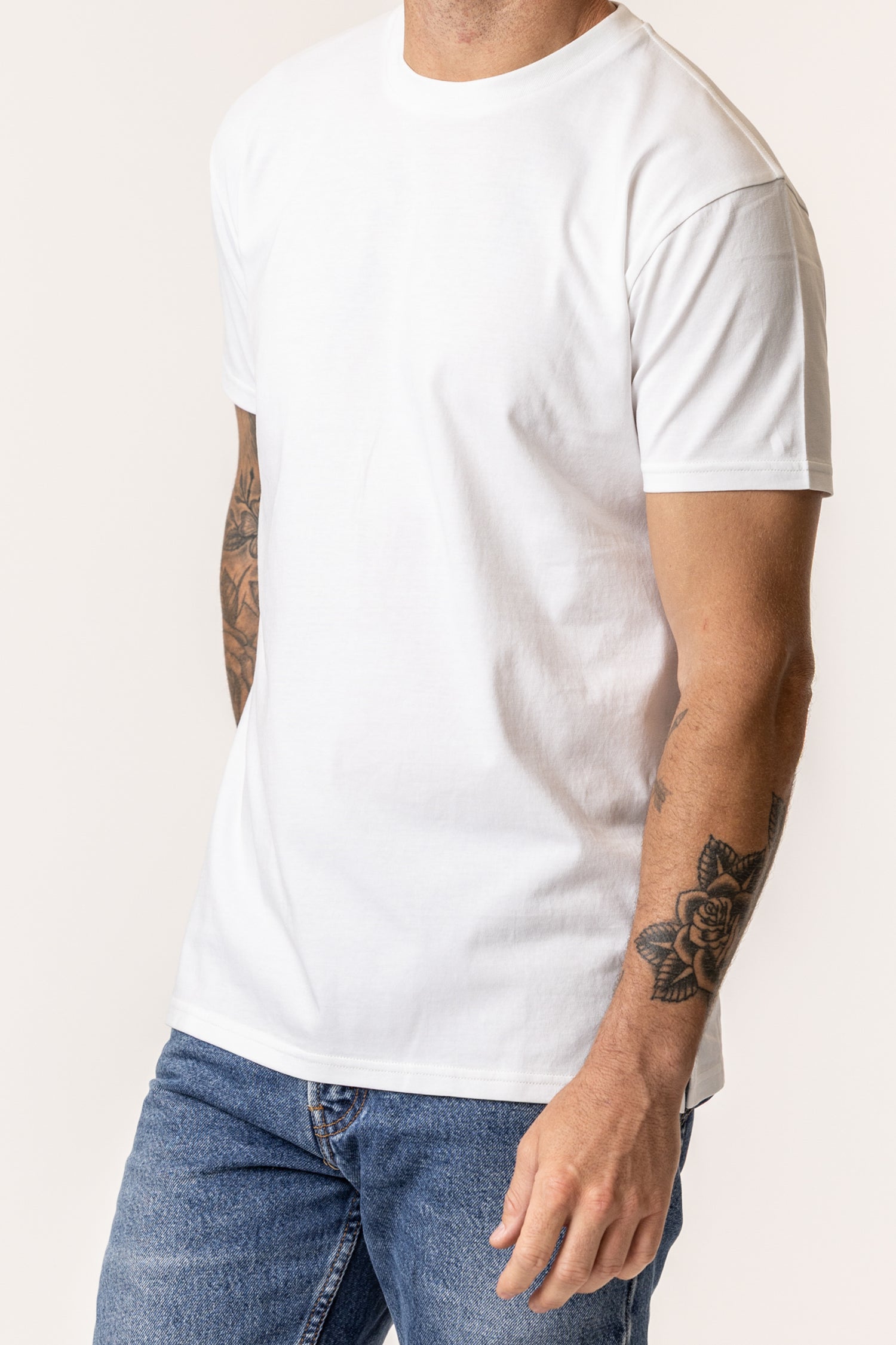 Person wearing a plain organic cotton white t-shirt