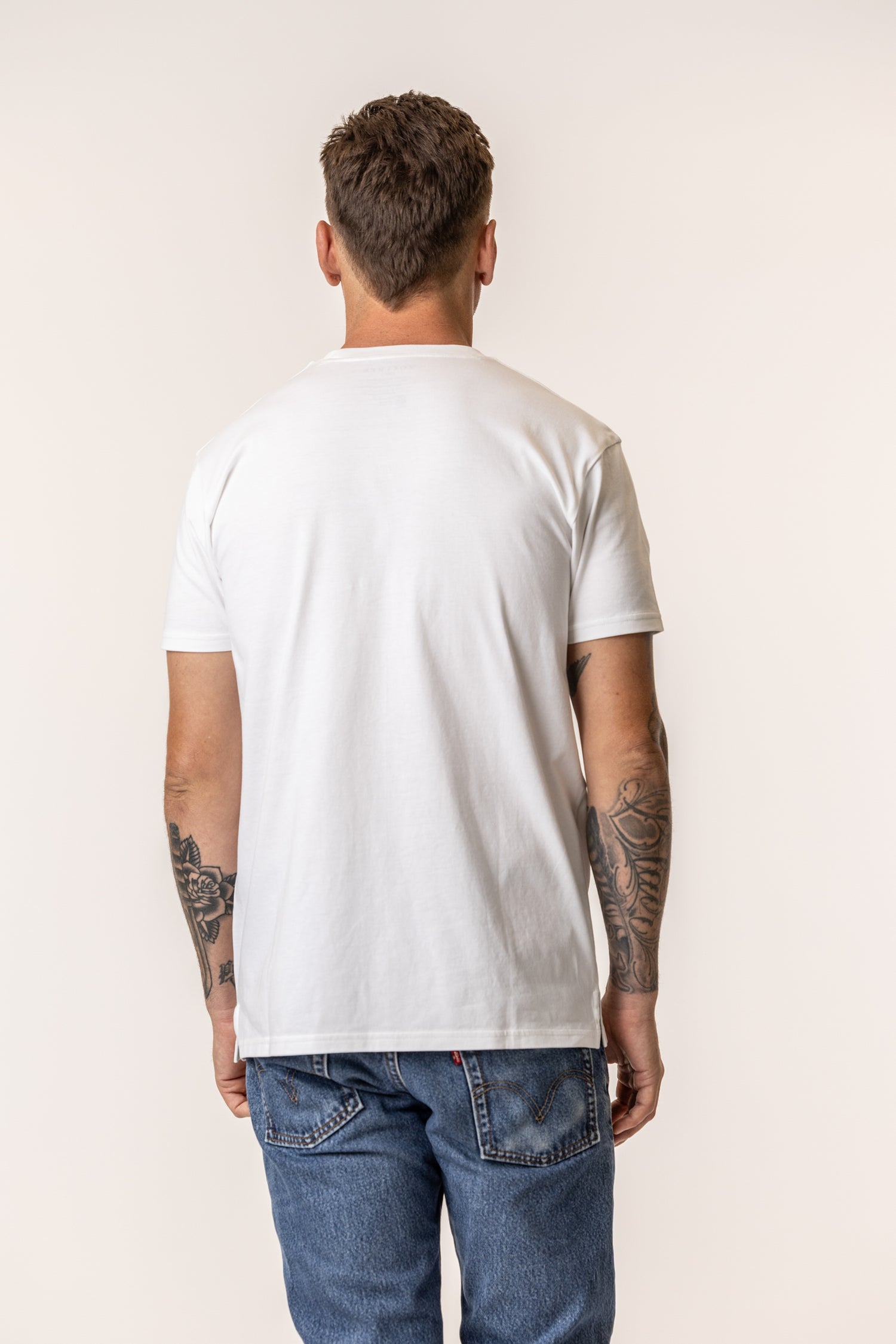 Person wearing a plain cotton white t-shirt