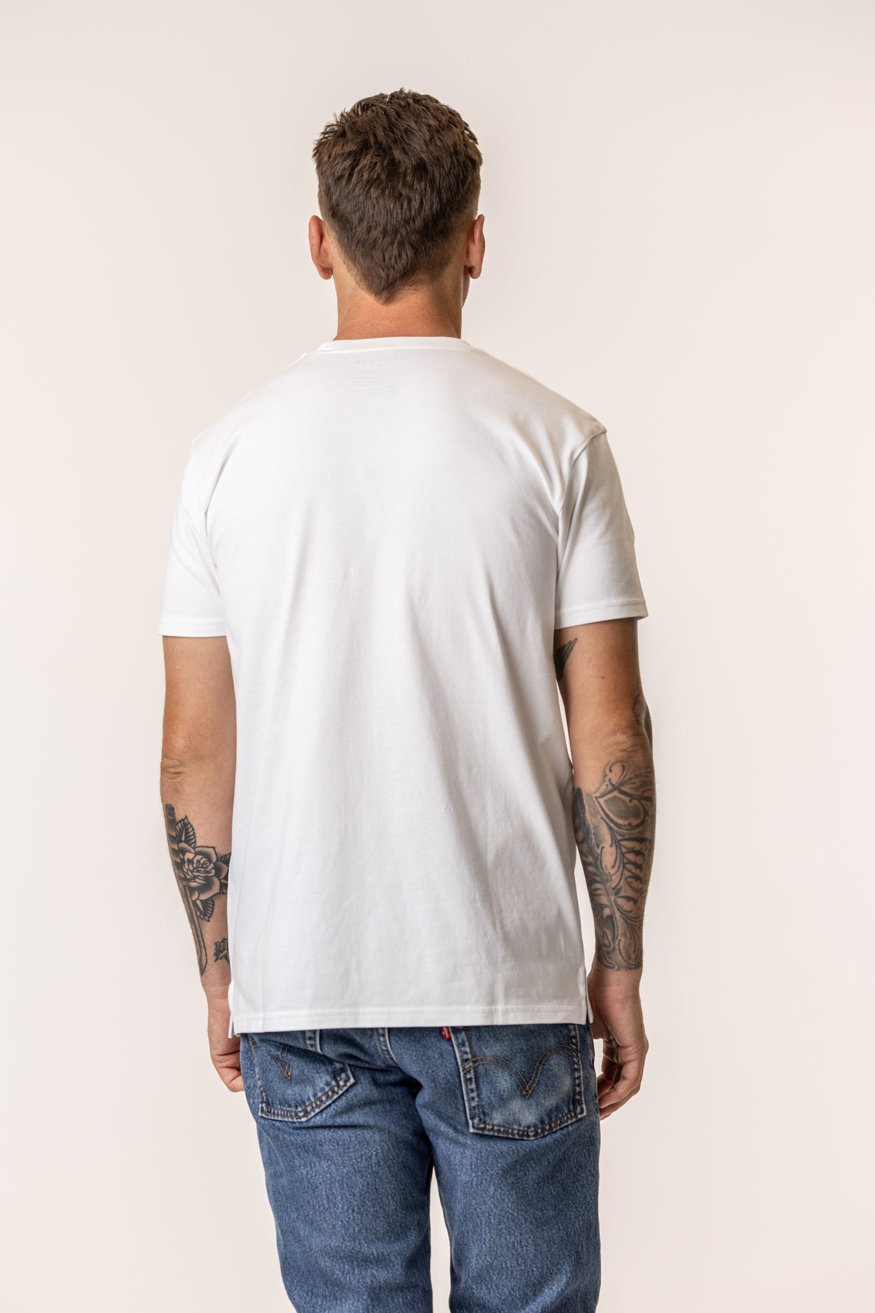 Person wearing a plain cotton white t-shirt