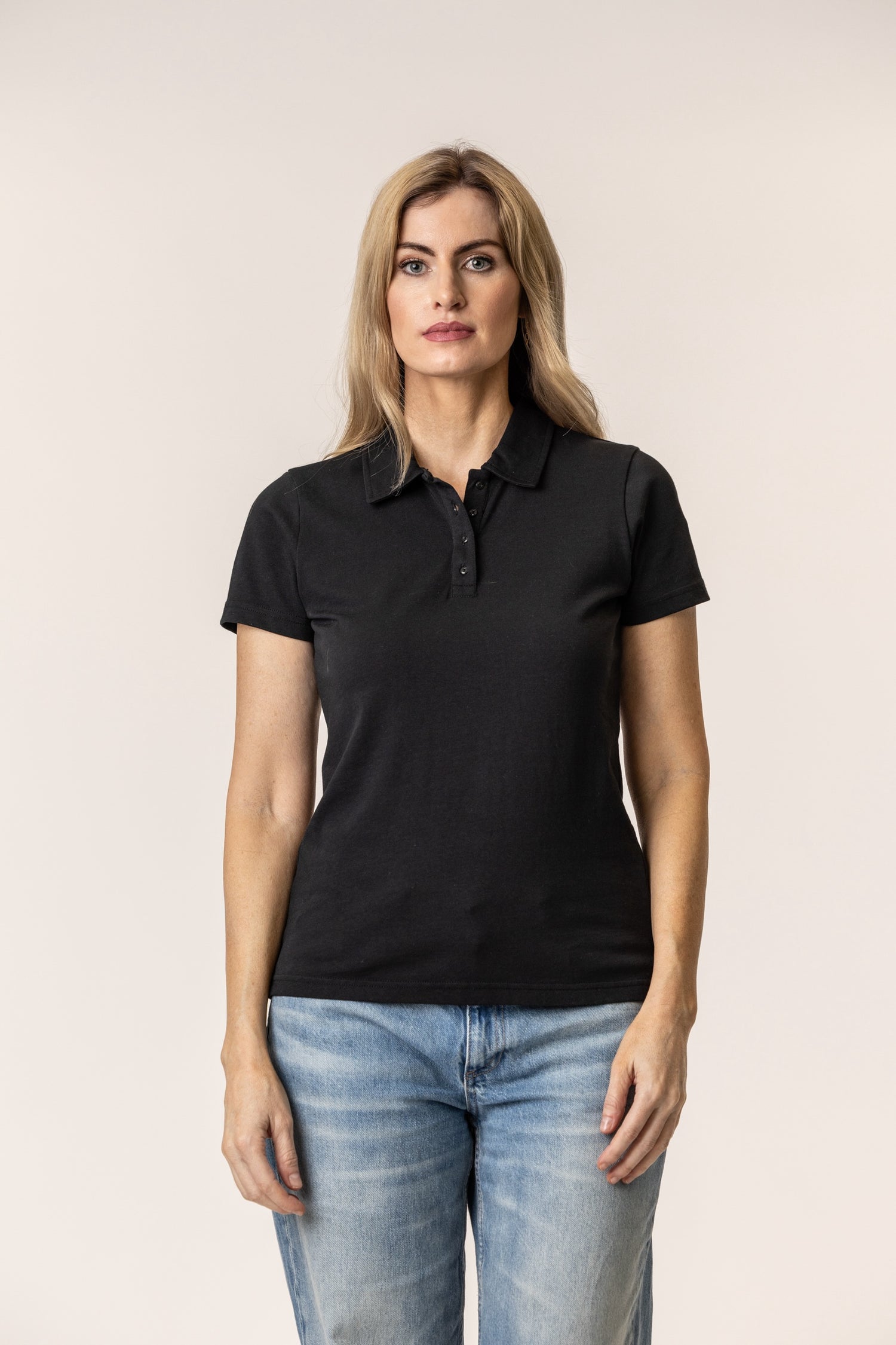 Woman wearing a black polo shirt