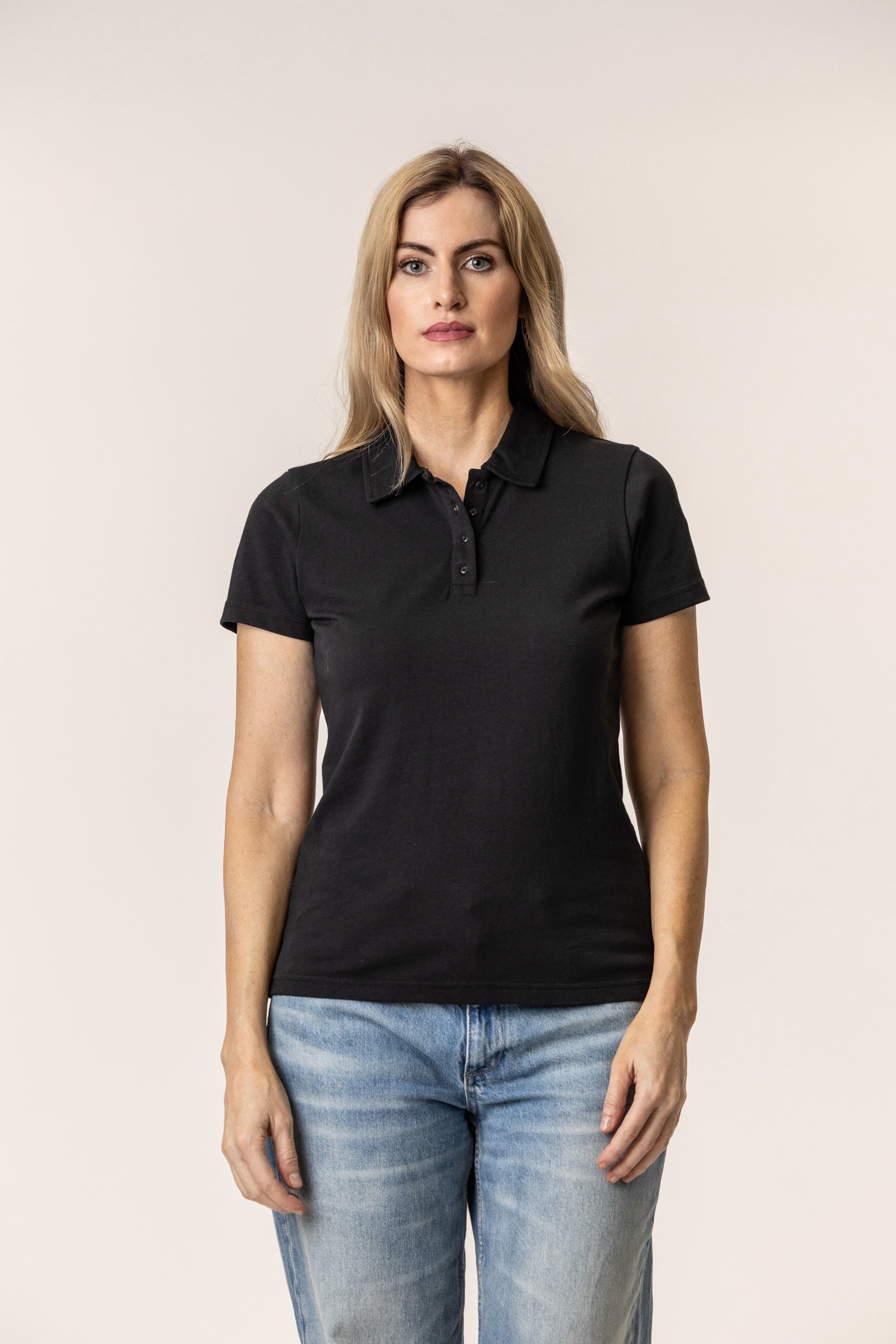 Woman wearing a black polo shirt