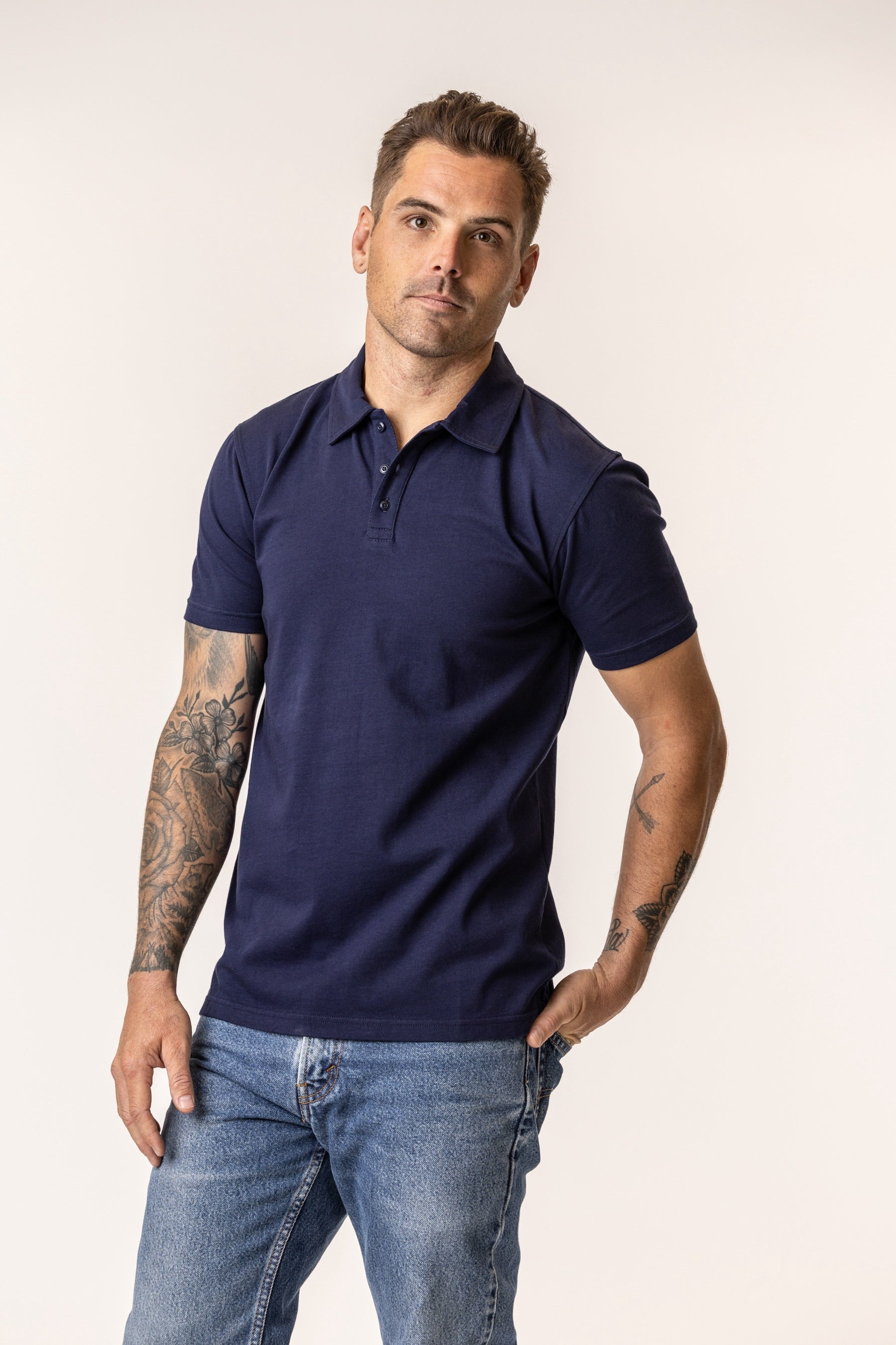 Man wearing a navy blue polo shirt