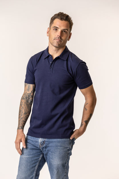 Man wearing a navy blue polo shirt