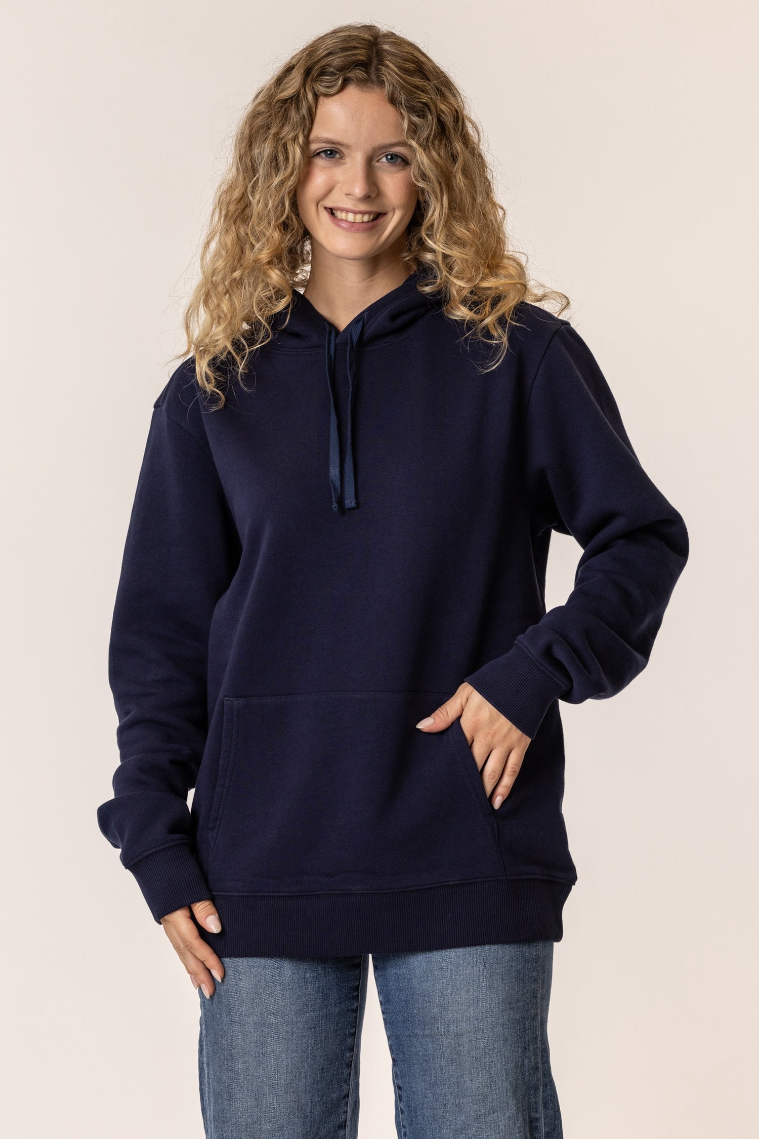 Woman wearing a navy blue pullover hoodie