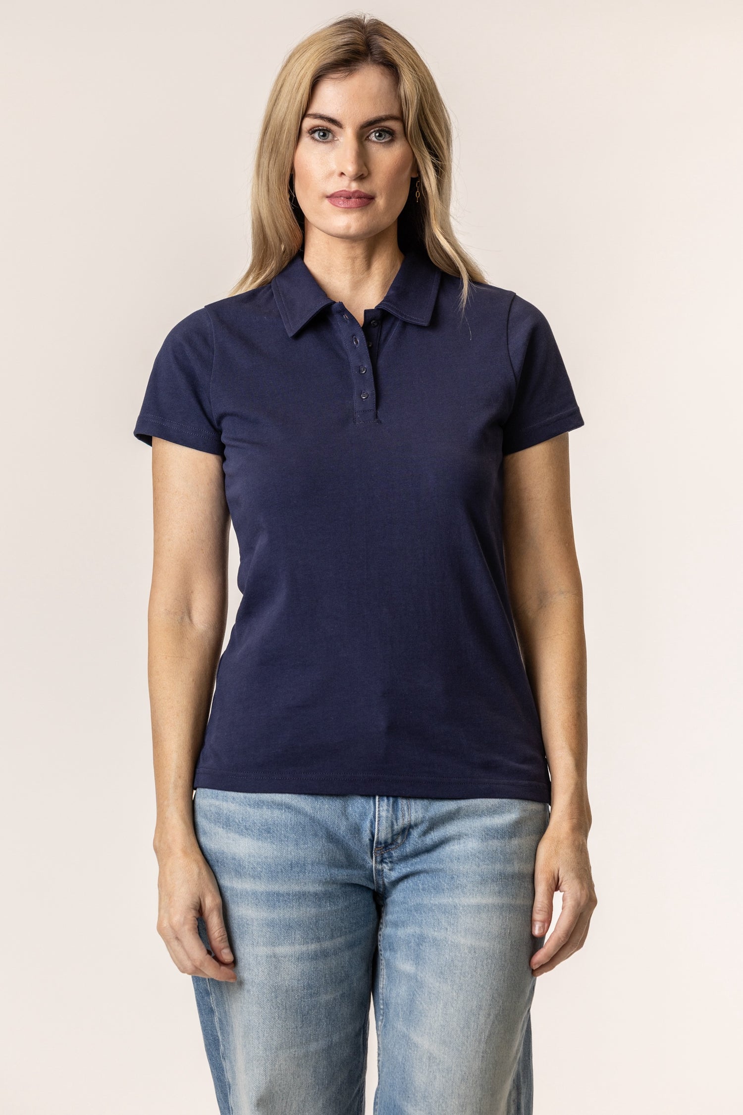 Woman wearing a navy blue polo shirt