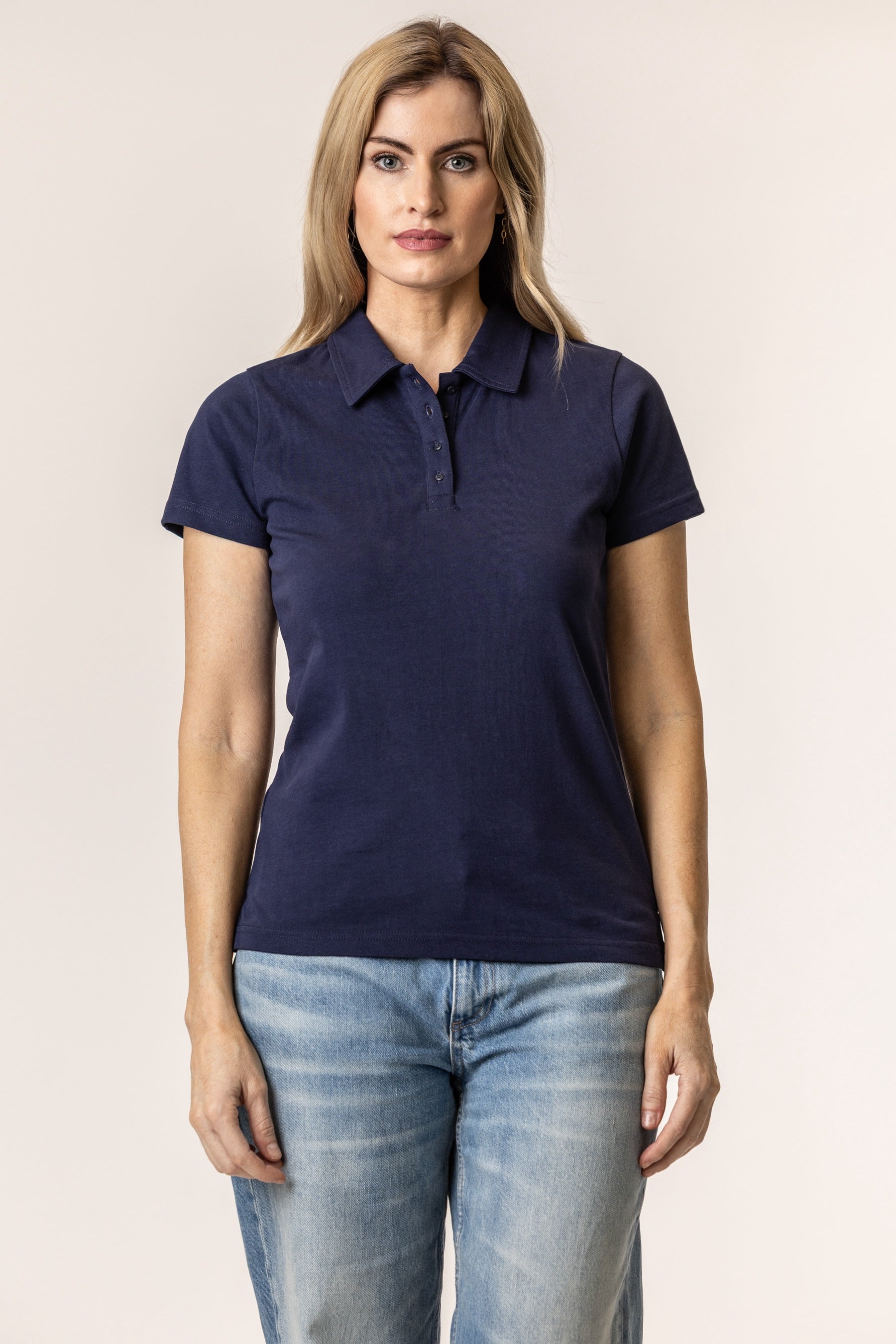 Woman wearing a navy blue polo shirt